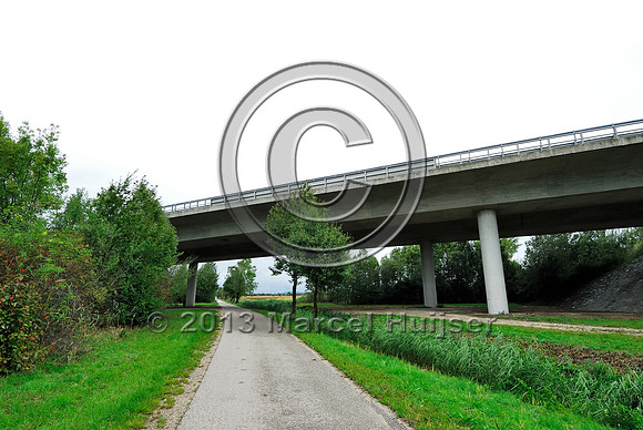 Farm road, ditch and bike pedestrian pathway, multifunctional underpass, across A4 motorway, Parndorf, Austria.