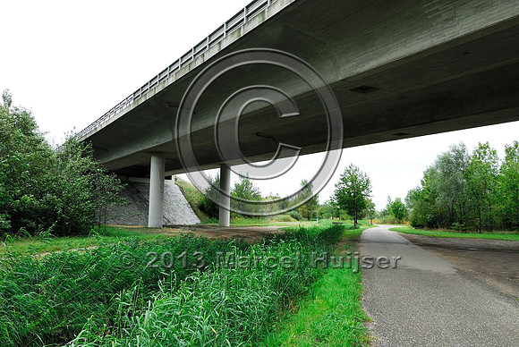 Farm road, ditch and bike pedestrian pathway, multifunctional underpass, across A4 motorway, Parndorf, Austria.