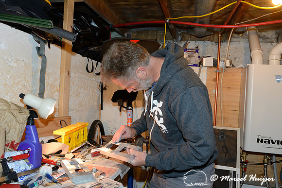 Marcel Huijser makes custom brackets for sensors that detect wildlife and that hook up to his cameras