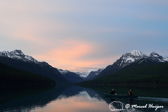 Evening canoeists at Bowman Lake, Glacier National Park, Montana, USA