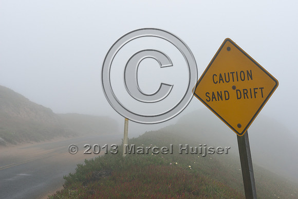 Warning sign, caution sand drift, on road, Point Reyes National Seashore, California, USA